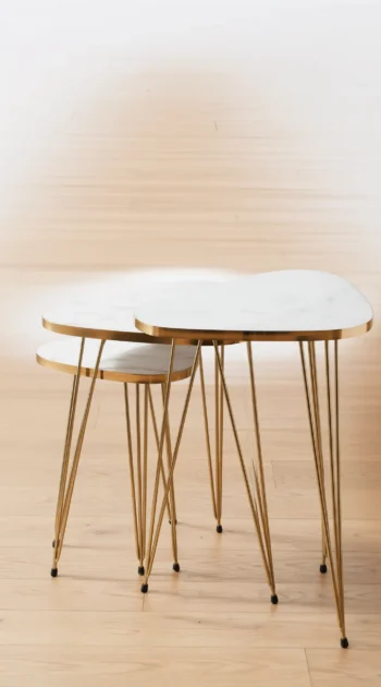 Pebble Nesting Tables with gold-trimmed pebble tops 1